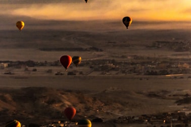 Hot-air balloons in the sky over Luxor at sunrise
